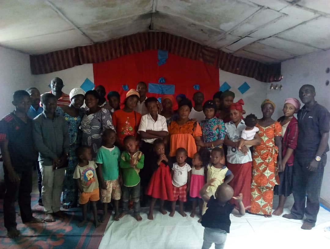Children and community members gathered at Maranatha Projects International